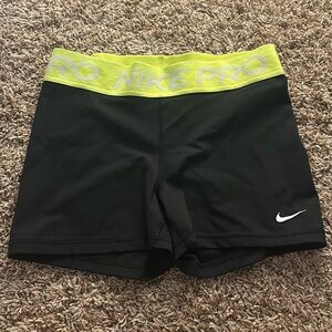 nike pros with a yellow band